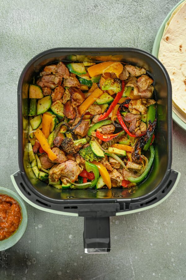 Air fryer with food being prepared